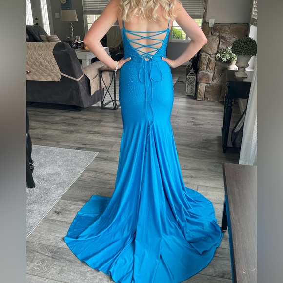 Beautiful size 0-2 teal blue prom dress. Stretch satin material with sparkle. - Picture 2 of 3